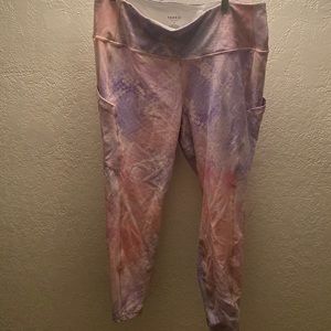 Torrid pink and lavender snake skin workout pants.